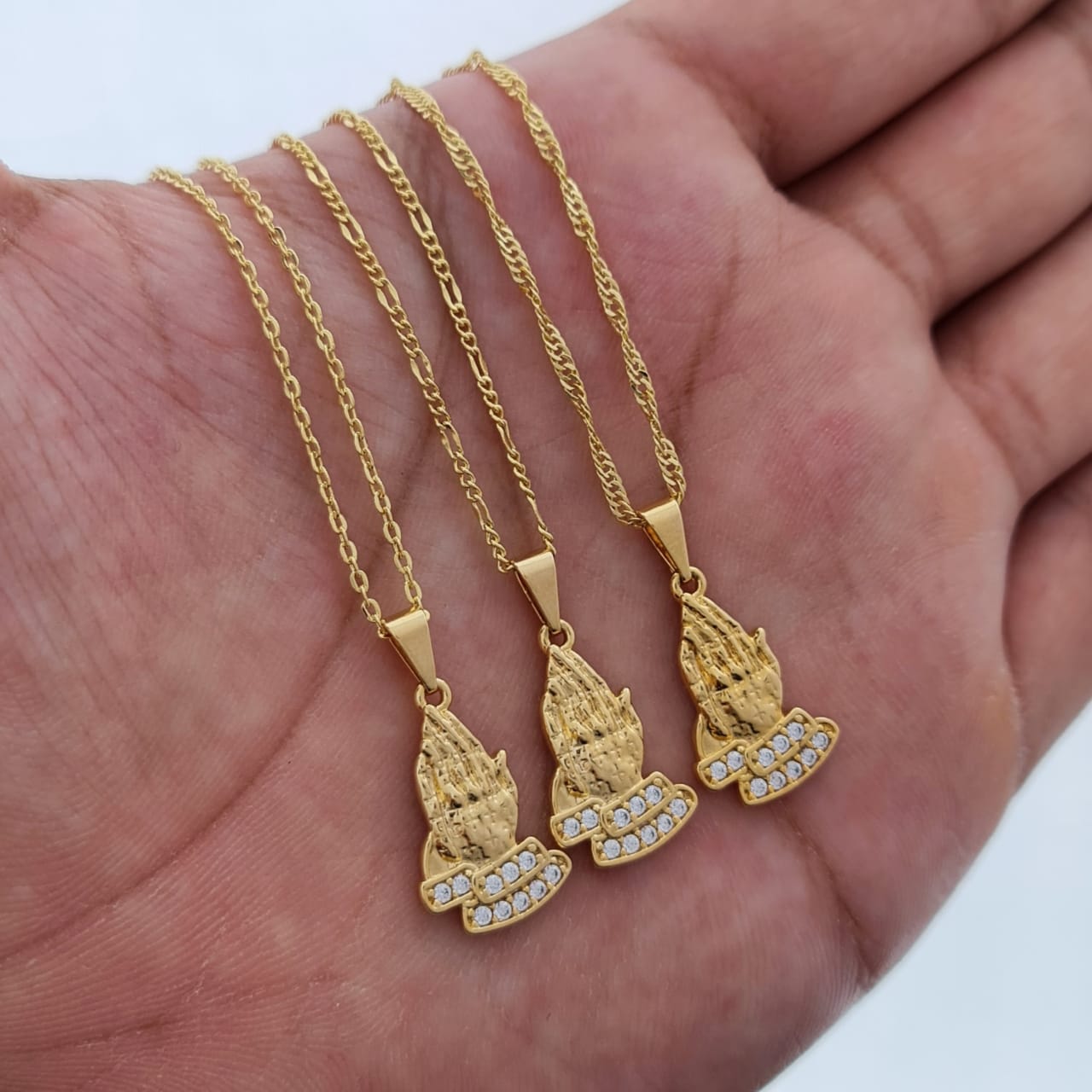 dije manos de oración