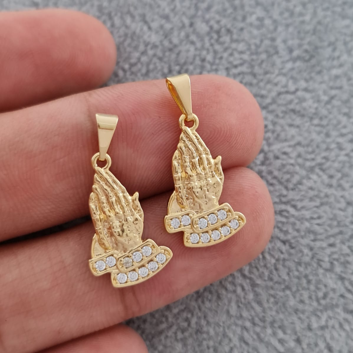 dije manos de oración
