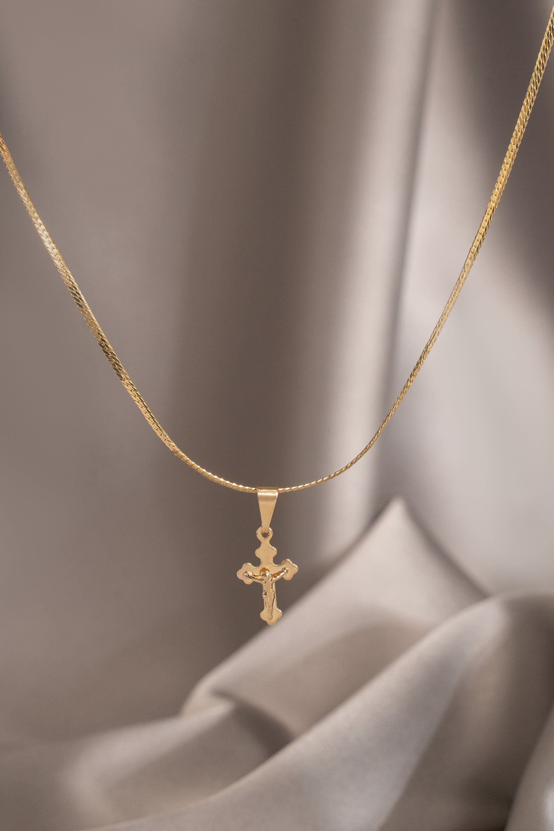 dije cristo pequeño