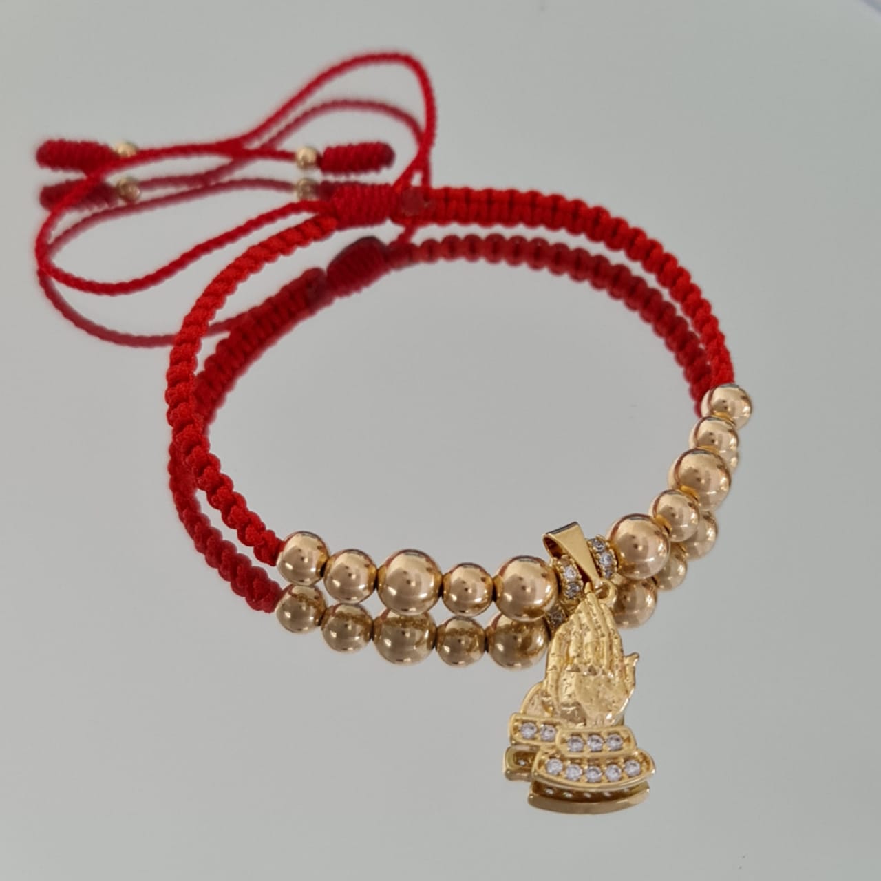dije manos de oración